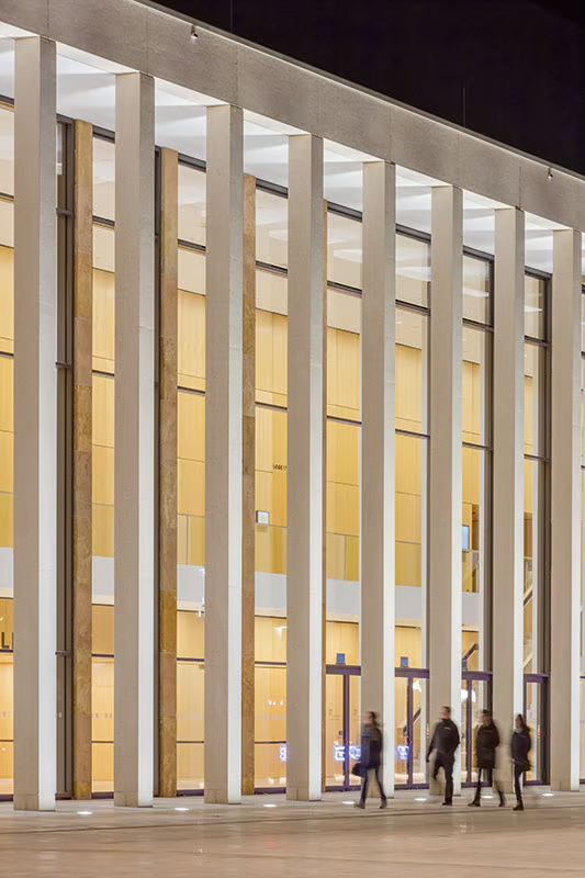 WE-EF ETC inground luminaires with 4000K neutral white illuminating concrete columns and warm wood paneling at RheinMain CongressCenter Hall 1 Wiesbaden