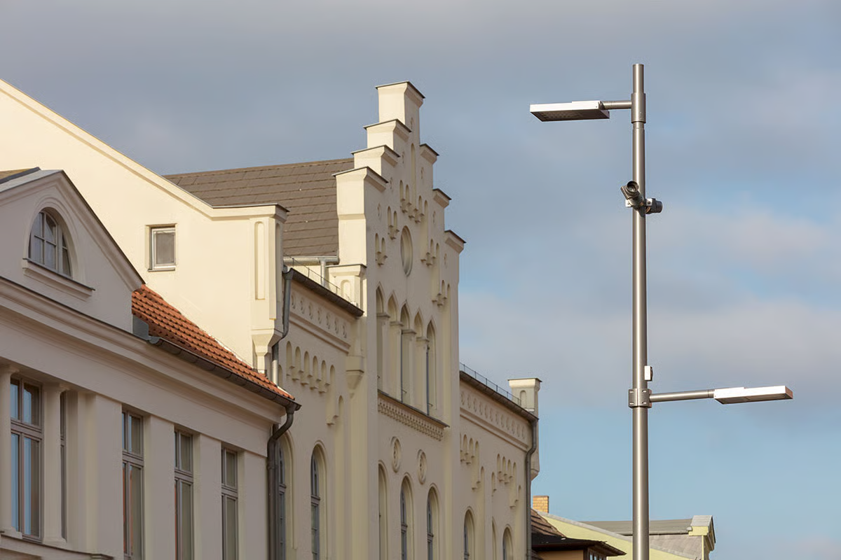 WE-EF VFL530-SE street lighting luminaires with S60 asymmetric lenses illuminating historic classicist buildings at Alexandrinenplatz Bad Doberan Germany