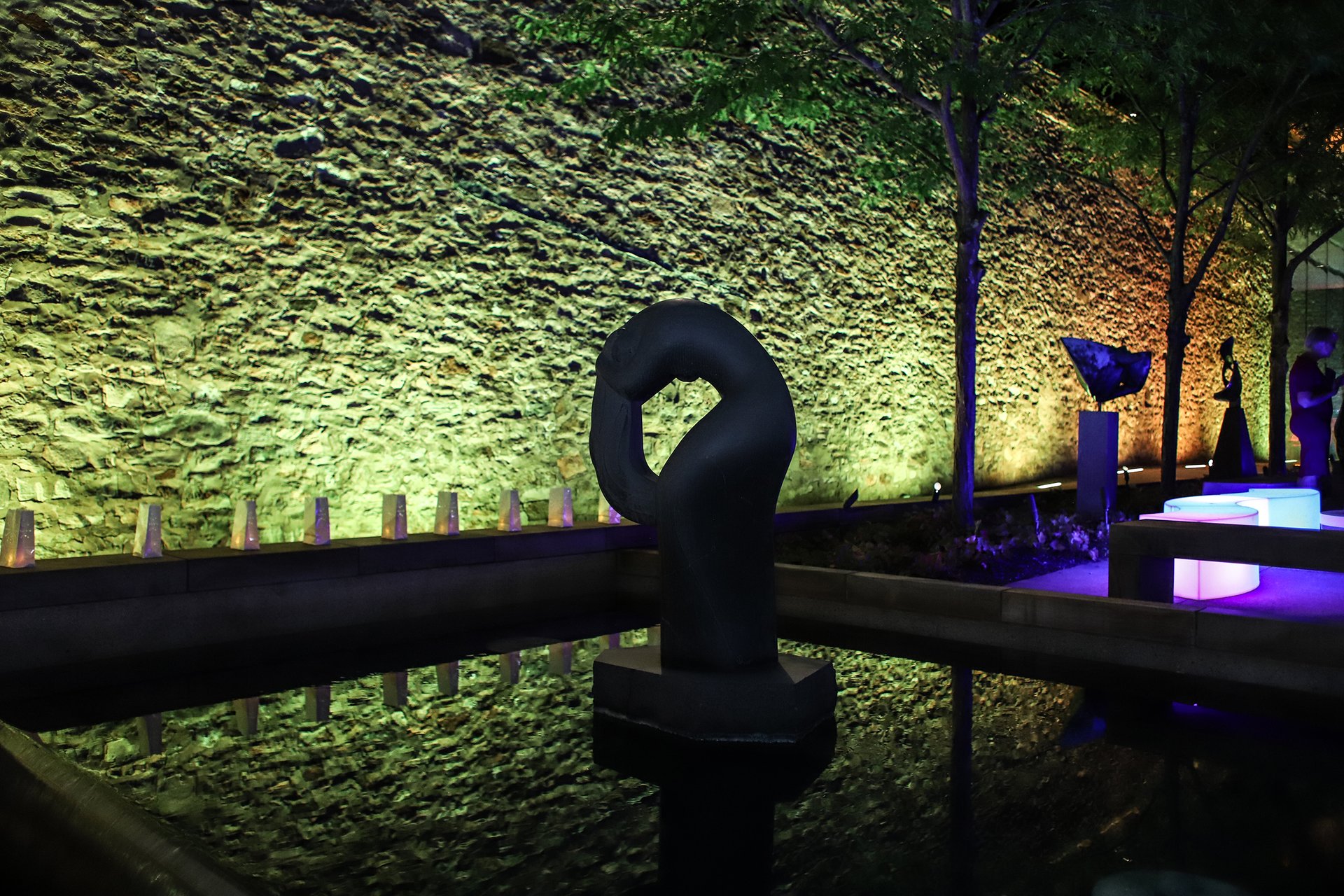 Sculture Garden, the back wall is lit yellow