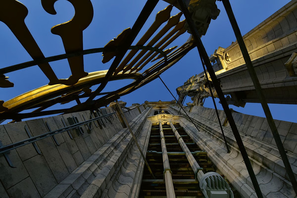 Looking up Cathedral of Our Lady spire illuminated by WE-EF FLC230 FLC240 FLC260 projectors with DMX control creating precise architectural lighting Belgium